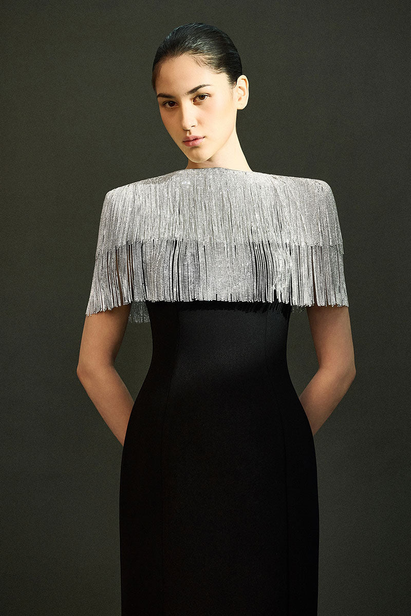 Elegant black sable gown by EEGEN STUDIO, featuring flowing fabric and sophisticated design, perfect for formal occasions.