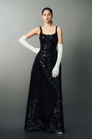 Black Anisa gown by Eegen Studio, elegant floor-length dress with a flowing silhouette and subtle detailing.