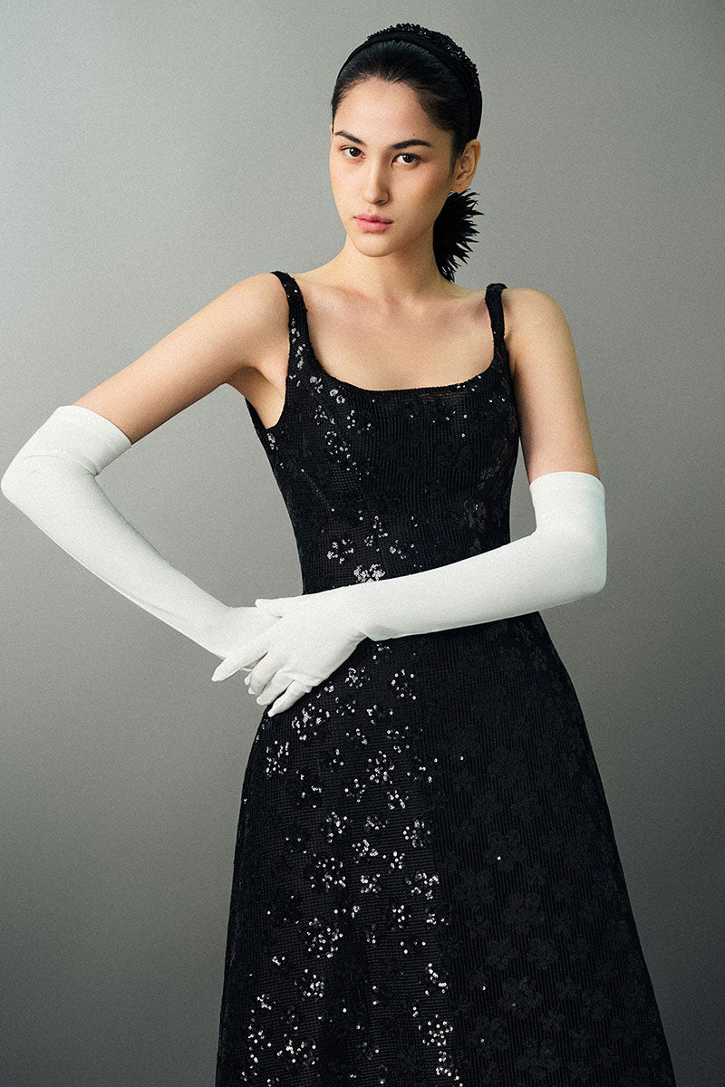 Black Anisa gown by EEGEN Studio, elegant evening dress with flowing fabric and intricate detailing, perfect for formal occasions.