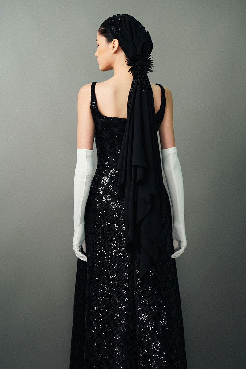 Black Anisa gown by Eegen Studio, featuring elegant fabric and detailed design, perfect for formal occasions.