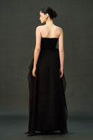 Black shale gown by EEGEN STUDIO featuring elegant design and flowing fabric, perfect for formal occasions.