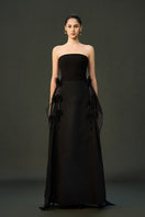 Black shale gown by EEGEN STUDIO, flowing fabric and elegant design, shown on a model with a full-length view.