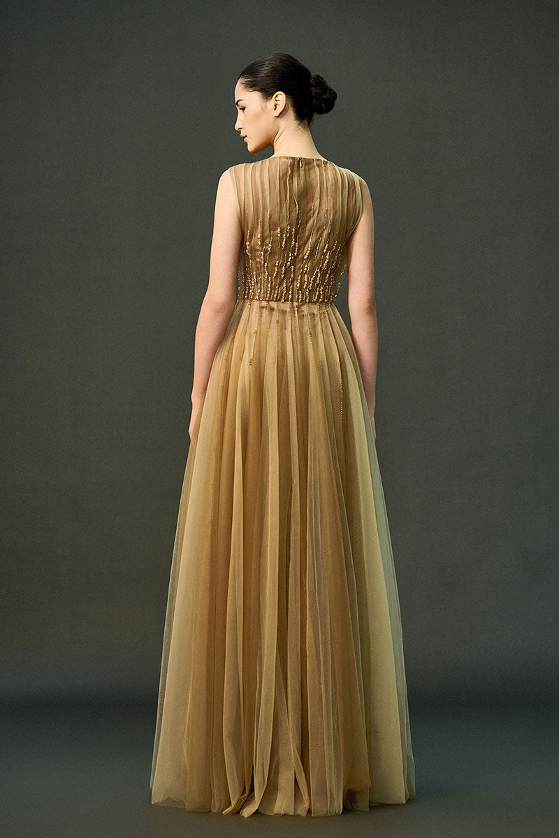 Light brown Noura gown by EEGEN STUDIO, flowing dress with elegant fabric and detailed design, perfect for formal occasions.
