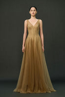 Caramel brown Samara gown by EEGEN STUDIO, elegant floor-length dress with flowing fabric and intricate design details.
