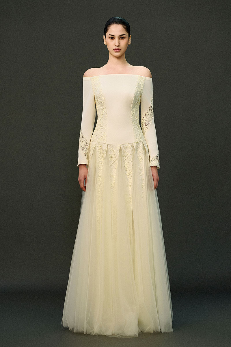 Off-white ELIRA gown by EEGEN STUDIO, elegant dress with flowing fabric and intricate detailing, perfect for formal occasions.