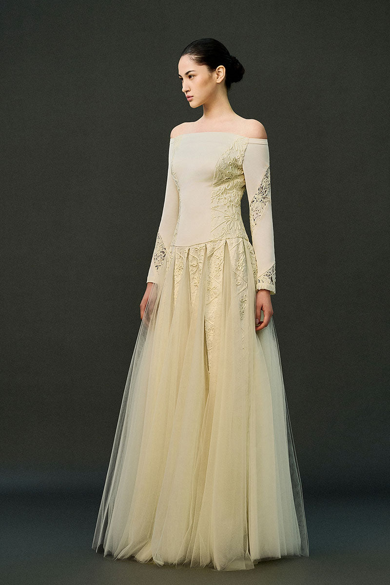 Off-white ELIRA gown by EEGEN STUDIO, elegant long dress with flowing fabric and intricate details, perfect for formal occasions.
