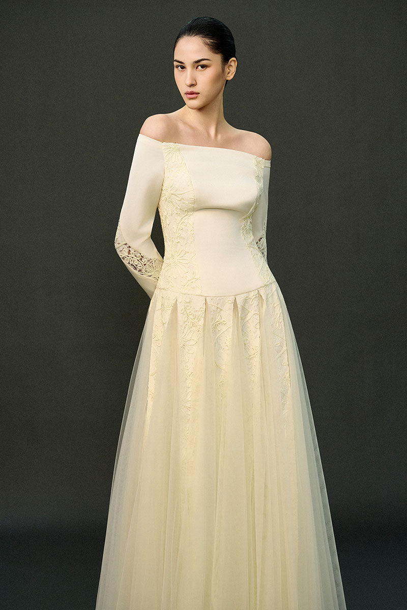 Off-white ELIRA gown by EEGEN STUDIO featuring elegant fabric and flowing design, perfect for formal occasions.