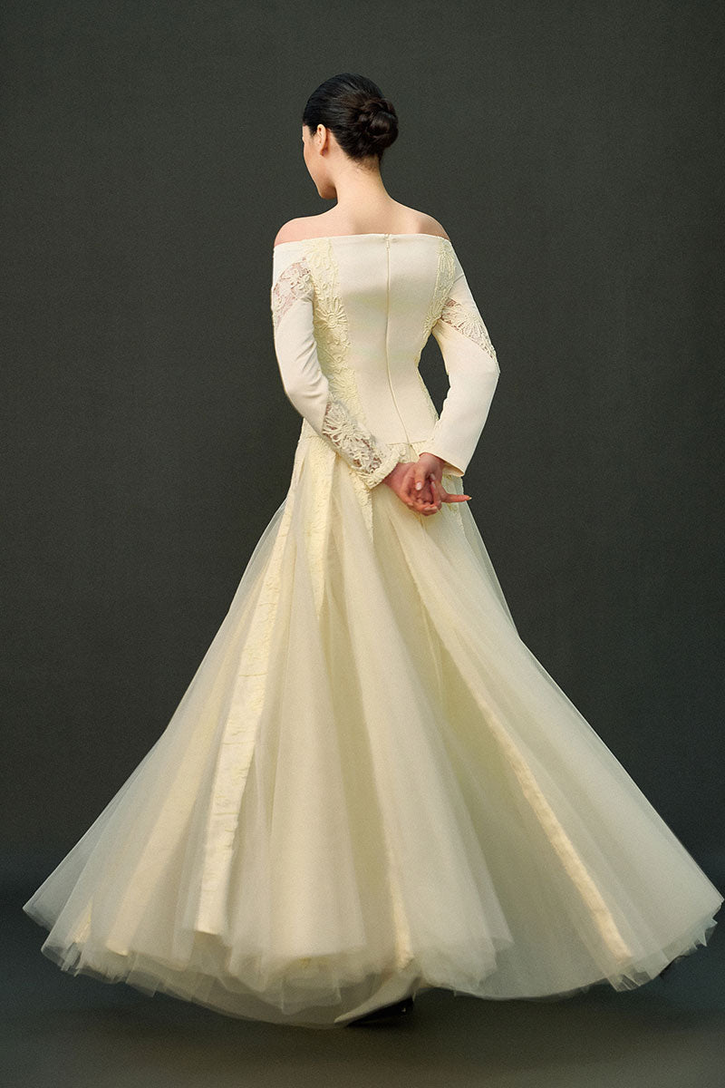Off-white ELIRA gown by EEGEN STUDIO, featuring elegant fabric and design, perfect for formal occasions.