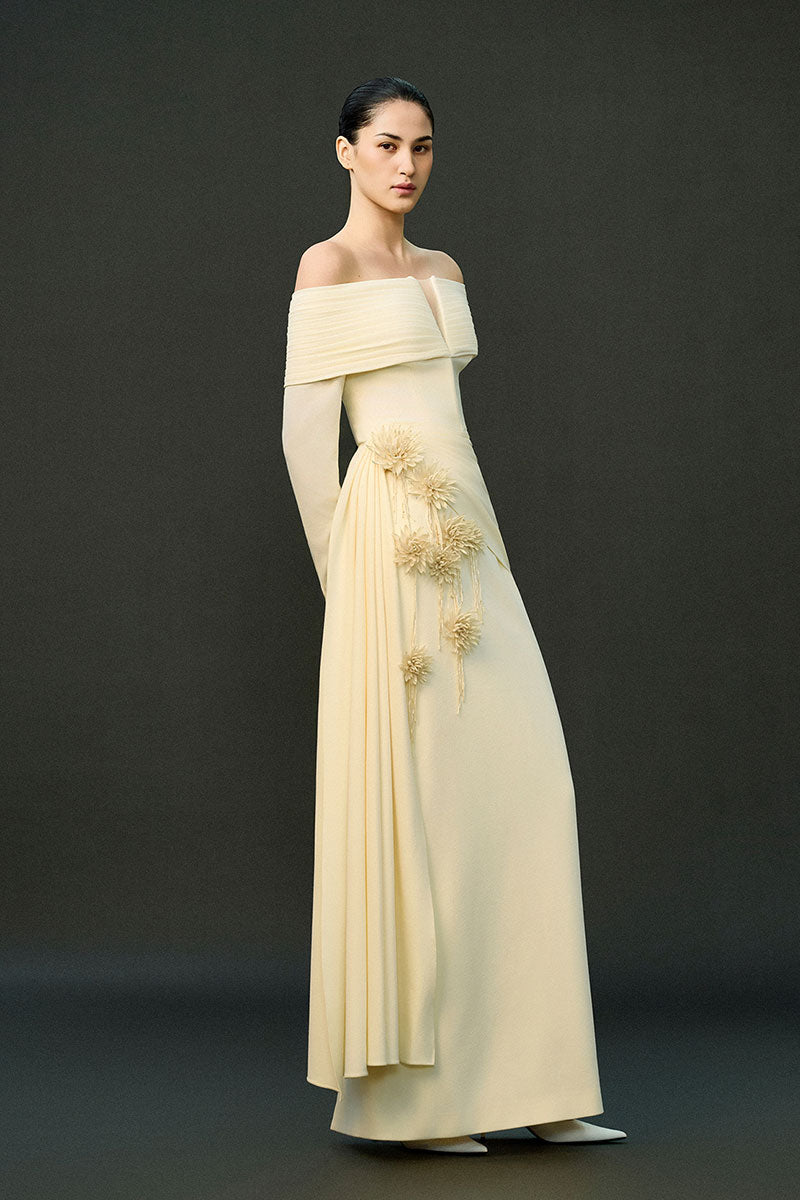 Off-white Amira gown from EEGEN STUDIO featuring elegant fabric and flowing design, perfect for formal occasions.
