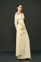 Off-white Amira gown from EEGEN STUDIO featuring elegant fabric and flowing design, perfect for formal occasions.