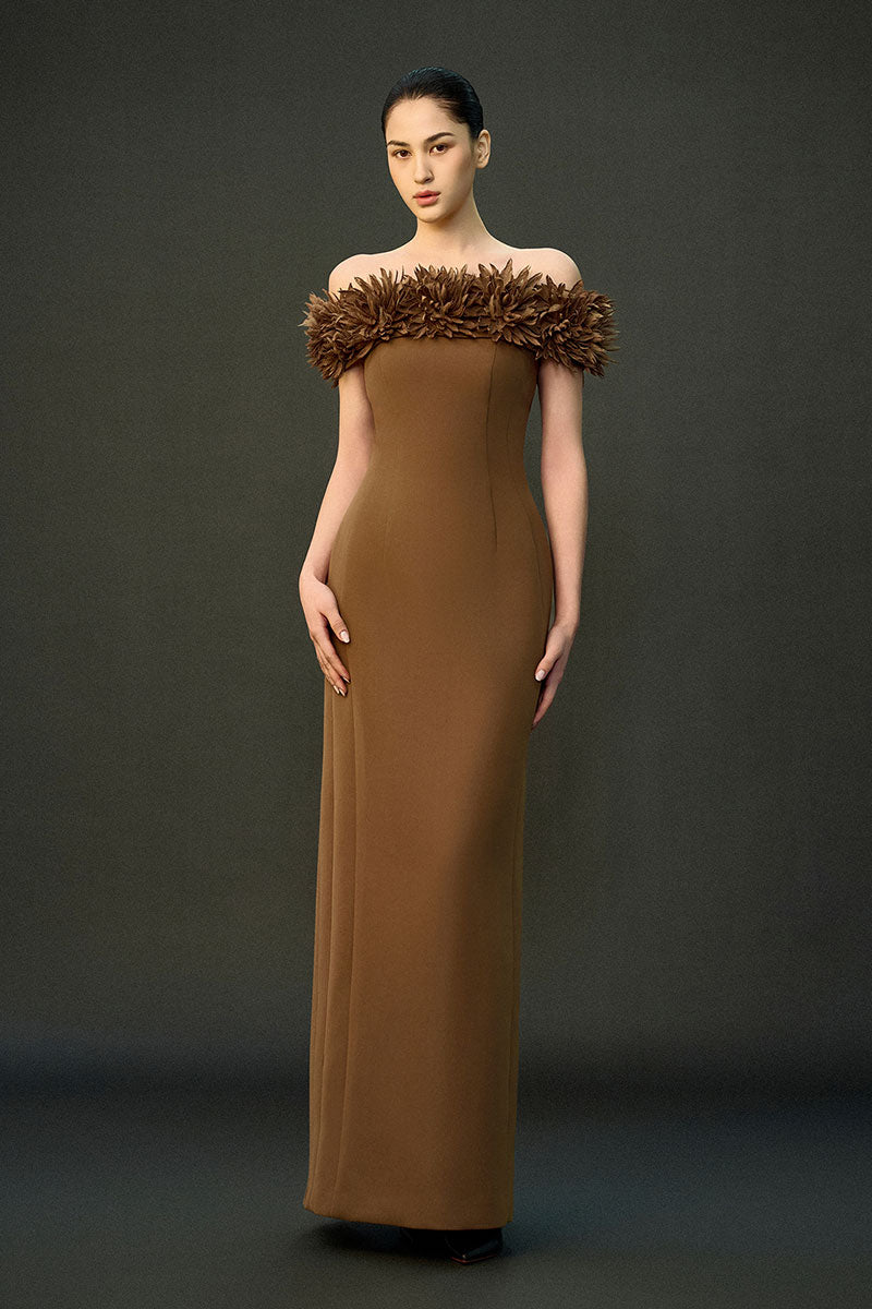 Brown AREEN gown by EEGEN STUDIO displayed on a hanger with detailed fabric texture and elegant design.