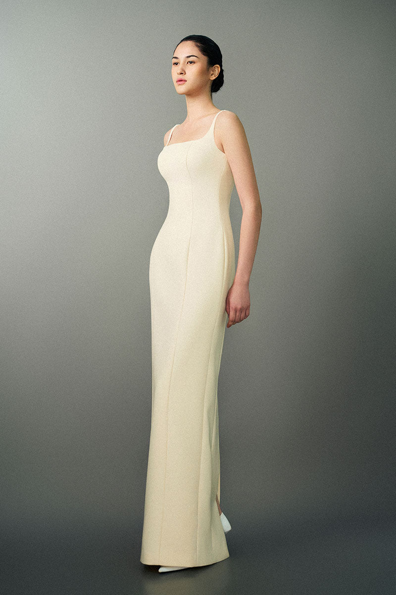 Off-white Nayla gown by EEGEN Studio featuring elegant fabric and flowing silhouette, perfect for formal occasions.