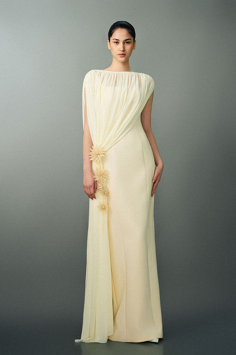 Off-white NAYLA gown by EEGEN STUDIO featuring elegant fabric and intricate design, displayed on a mannequin.