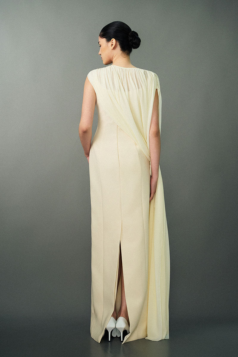 Off-white Nayla gown by EEGEN STUDIO featuring elegant fabric and flowing design, perfect for formal occasions.