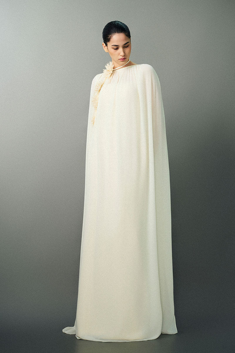 Off-white NAYLA gown by EEGEN STUDIO featuring elegant fabric and flowing design, perfect for formal occasions.