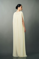 Off-white NAYLA gown by EEGEN STUDIO, featuring elegant fabric and detailed design, displayed on a mannequin.