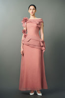 Pink RANYA dress gown by EEGEN STUDIO displayed on a hanger, showcasing elegant fabric and detailed design.