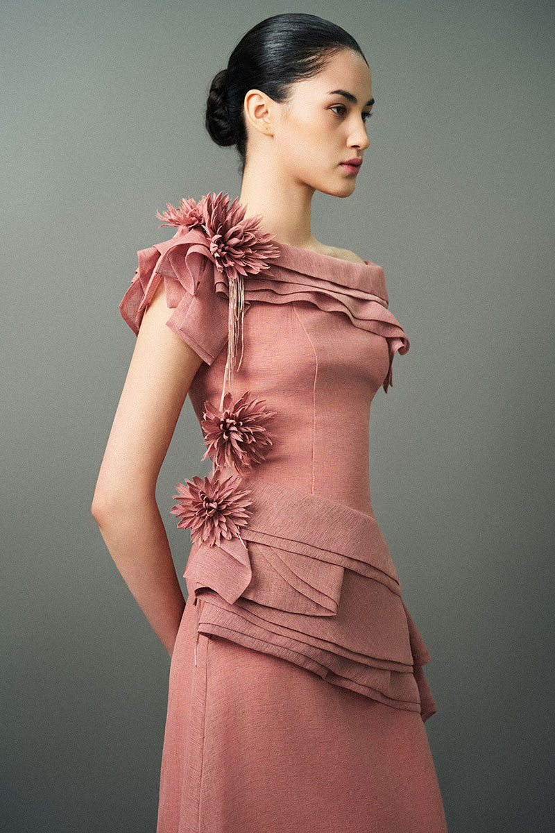 Pink RANYA gown by EEGEN STUDIO, flowing fabric with intricate details, displayed on a mannequin.