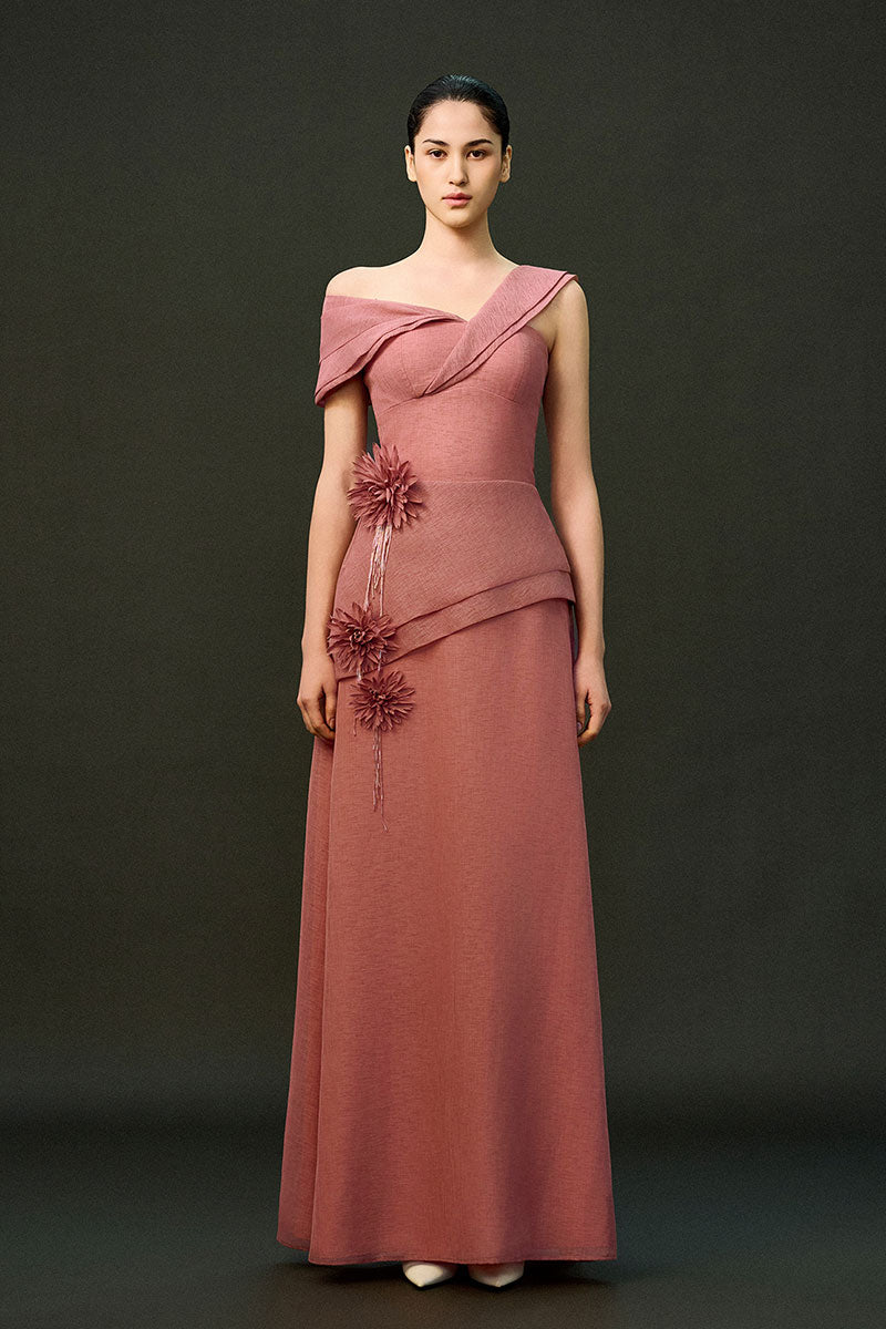 Pink EEGEN STUDIO CYRA gown with elegant design, featuring flowing fabric and detailed craftsmanship.