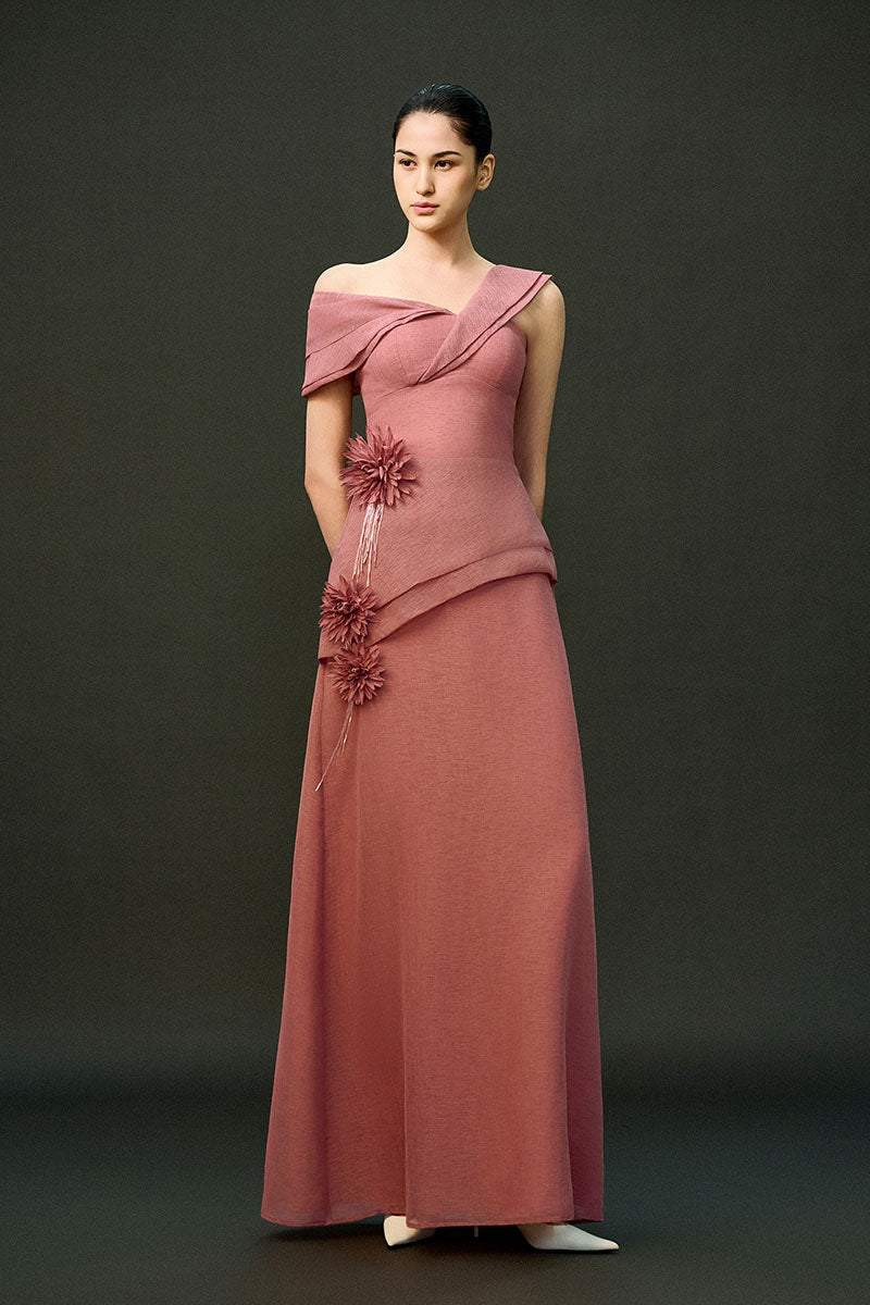 Pink Cyra gown by EEGEN STUDIO featuring elegant fabric and detailed design, displayed on a mannequin.