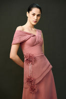 Pink CYRA dress gown by EEGEN STUDIO, featuring elegant fabric and detailed design, displayed on a hanger.