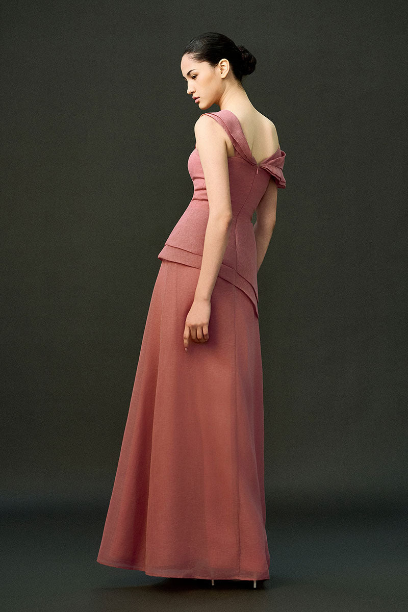 Pink Cyra gown by Eegen Studio, elegant evening dress with flowing fabric and intricate detailing, perfect for formal occasions.