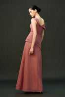Pink Cyra gown by Eegen Studio, elegant evening dress with flowing fabric and intricate detailing, perfect for formal occasions.