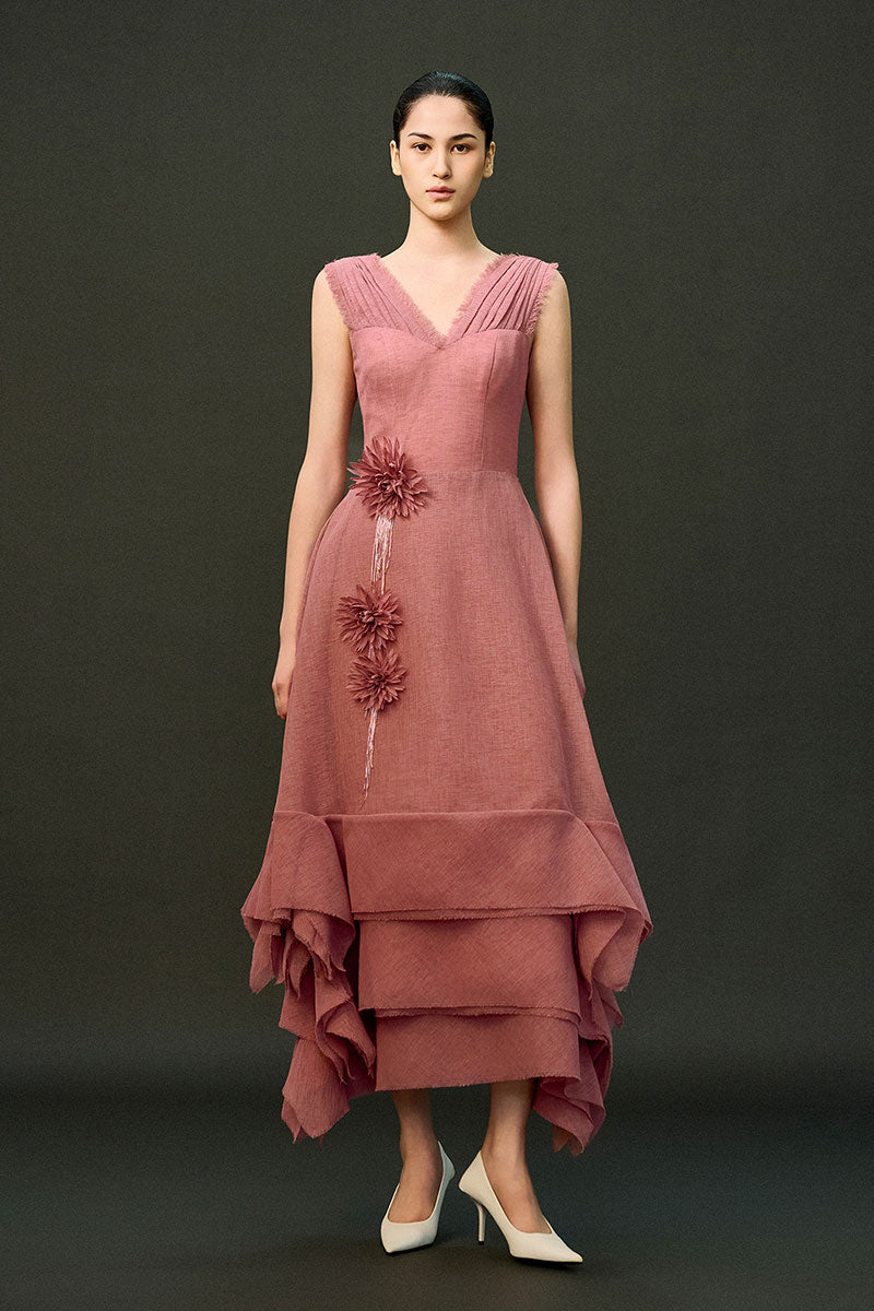 Pink EEGEN STUDIO DUNE gown with flowing fabric and elegant design, perfect for formal occasions.