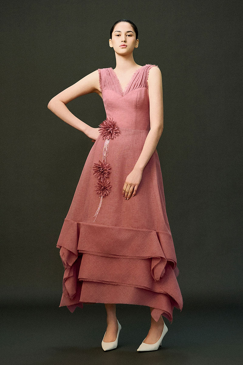 Pink EEGEN STUDIO DUNE gown with flowing fabric and elegant design, perfect for formal occasions.