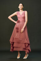 Pink EEGEN STUDIO DUNE gown with flowing fabric and elegant design, perfect for formal occasions.