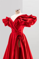 White Monetre Red Volume Sculpted Gown displayed on a mannequin, featuring elegant draping and a fitted silhouette.