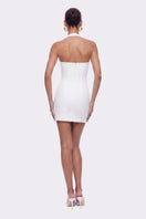 White Sabina mini dress by Nana Jacqueline with ring cutout design, shown on a model against a neutral background.
