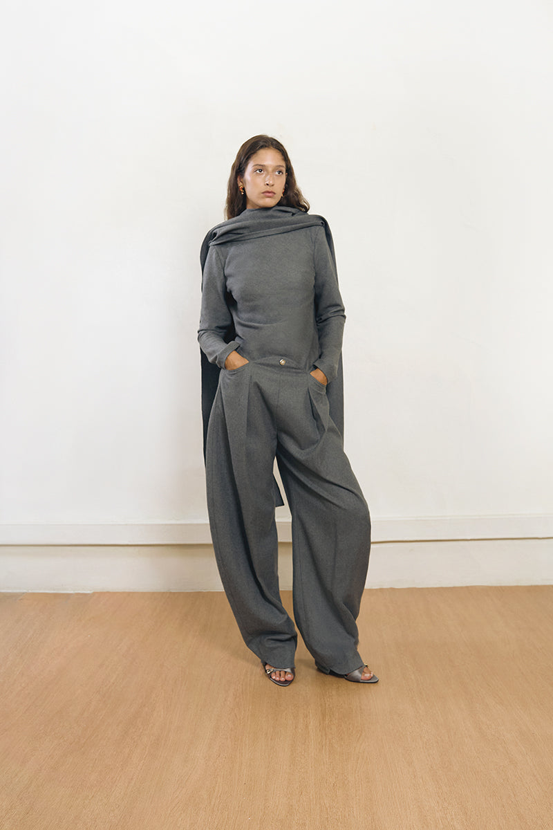 Gray safety top by Yassmin Saleh, featuring a comfortable wool design and a front view.