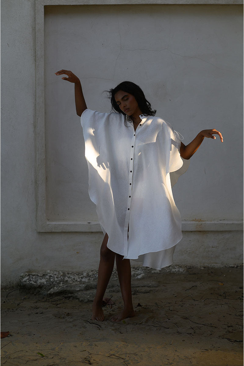 Off-white Saona beach cover-up by ANA + MARIA, lightweight fabric with flowing design perfect for beach or poolside wear.