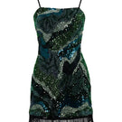 Green Saphira dress by Rayane Bacha, a stylish mini dress with a fitted silhouette and elegant design, shown on a model.