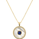 September birthstone sapphire necklace by Freya Rose featuring a vermeil gold chain and a mother-of-pearl pendant.