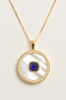 September birthstone sapphire necklace by Freya Rose with vermeil gold finish and mother-of-pearl accents.