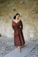 Ana + Maria Sasha Mahogany midi dress displayed on a model, showcasing elegant design and rich mahogany color.