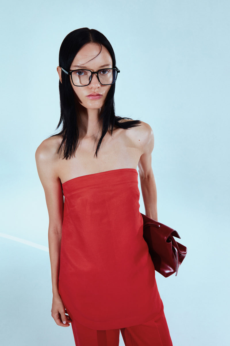 Sayya SKARLETT red top, casual short-sleeve blouse with a relaxed fit and round neckline, displayed on a hanger.