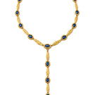 Jude Benhalim Poise Necklace featuring a delicate chain and elegant pendant, displayed on a neutral background.