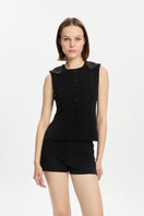 Black Bassigue scuba button-down vest, a stylish and versatile top with a sleek design and front button closure.