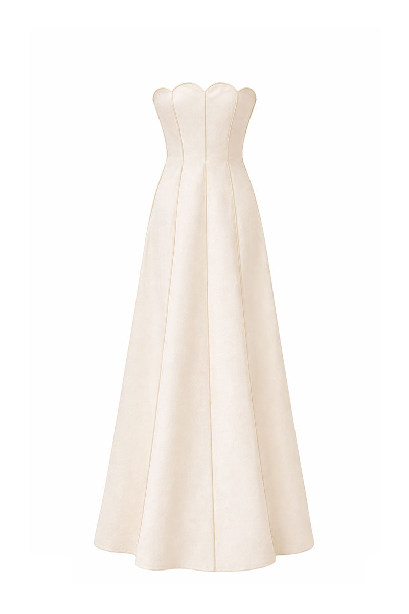 Off-white sea shell linen gown by Maylé Vásquez featuring a flowing design and elegant detailing.