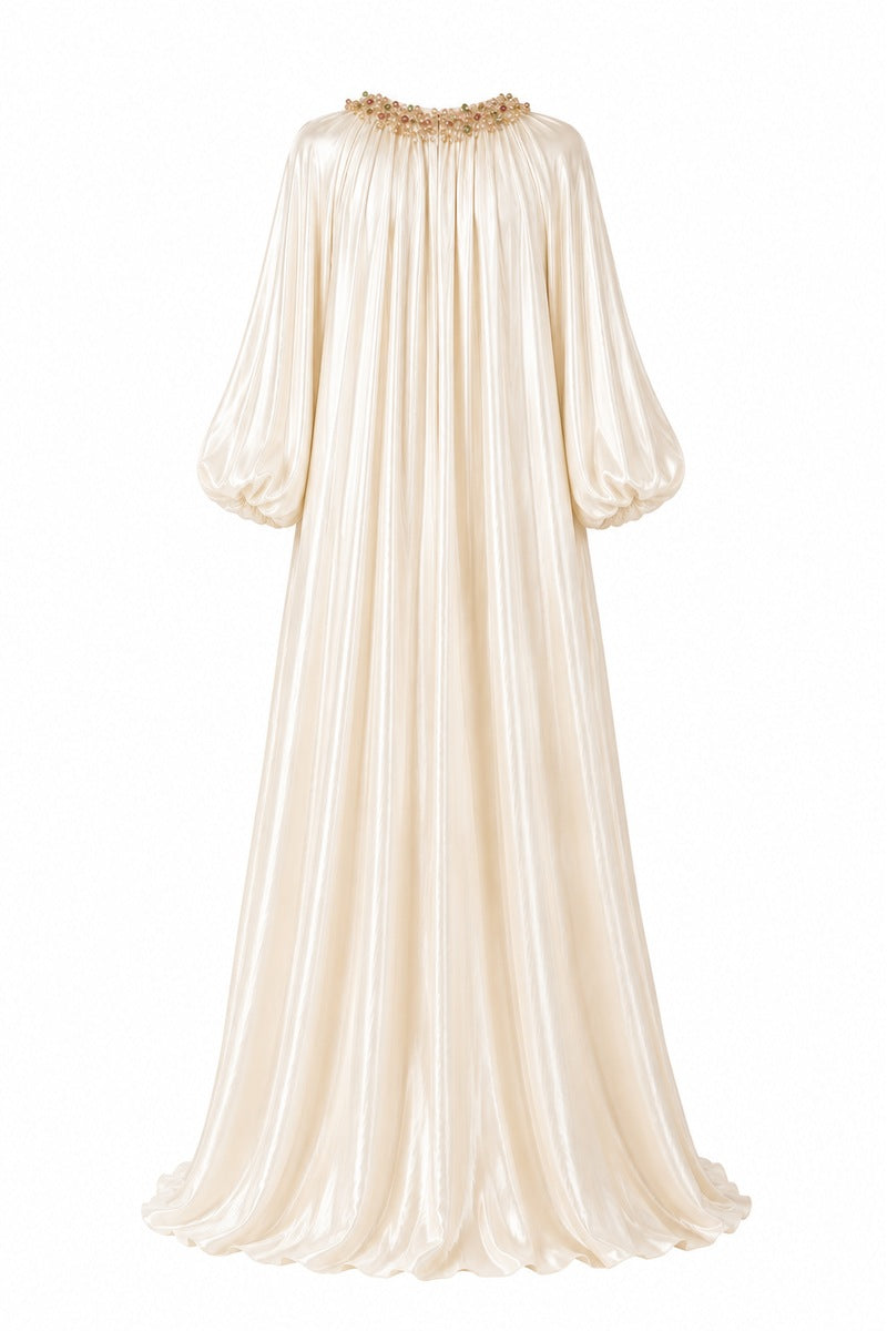 Nihan Peker Sedef vanilla gown featuring elegant fabric and flowing design, perfect for formal occasions.