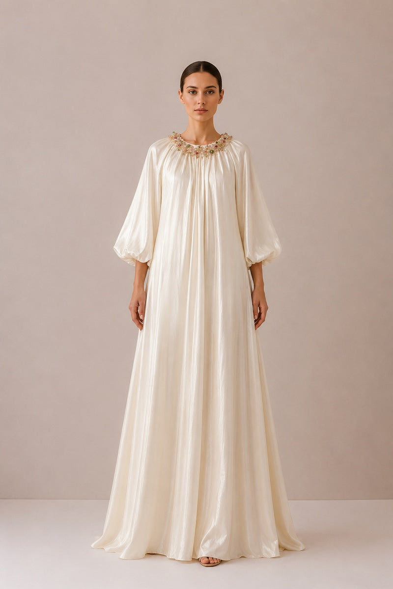 Nihan Peker Sedef vanilla gown with elegant flowing fabric and fitted waist, perfect for formal occasions.