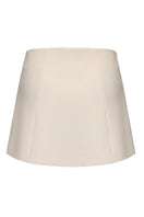 White Selena mini skirt by Nana Jacqueline, back view showing fitted waist and stylish A-line silhouette.