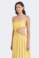 Yellow Selene draped maxi dress by Stolen Stores, flowing fabric and elegant design perfect for summer and special occasions.