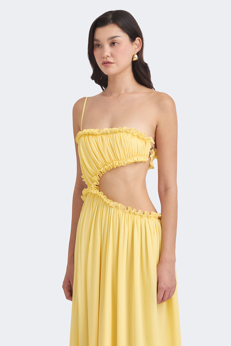 Yellow Selene draped maxi dress by Stolen Stores, flowing fabric and elegant design perfect for summer and special occasions.