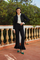Señorita Eugenia black pants, stylish women's trousers with a tailored fit, shown on a model in a fashion photoshoot.