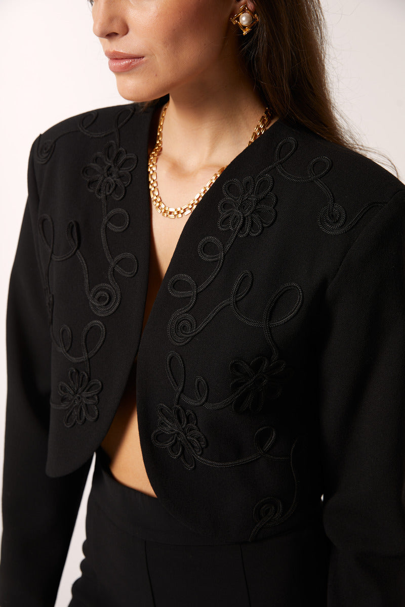 Black Señorita Maria blazer showcased on a model, featuring a tailored fit and classic style suitable for professional or casual wear.