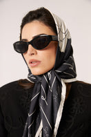 Black Señorita Luisa scarf, soft and stylish scarf with elegant drape, perfect for adding a sophisticated touch to any outfit.